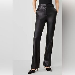 Faux leather flare pants with vent hem.